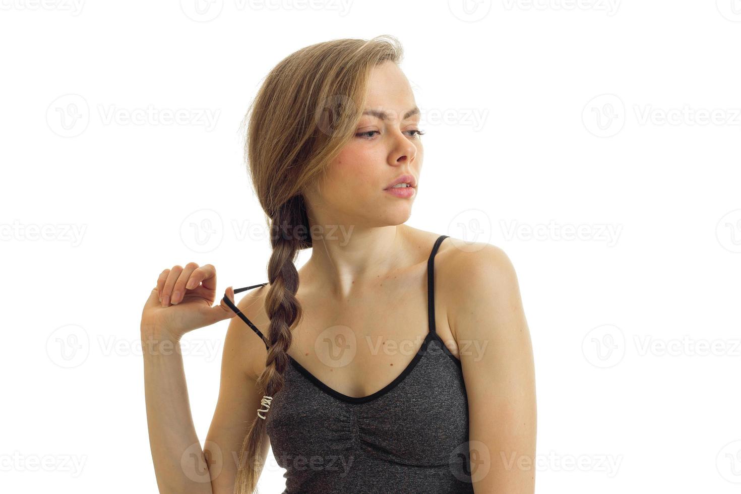 blonde with a pigtail keeps hand Mike and looks toward photo