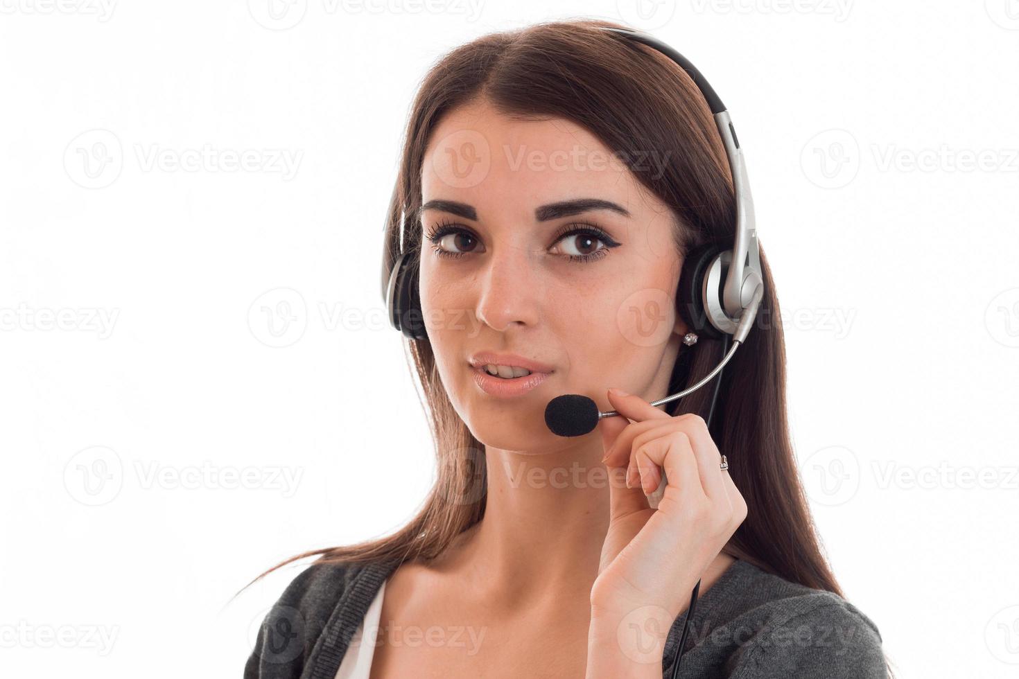 close up portrait of young beauty call office girl with headphones isolated on white background in studio photo