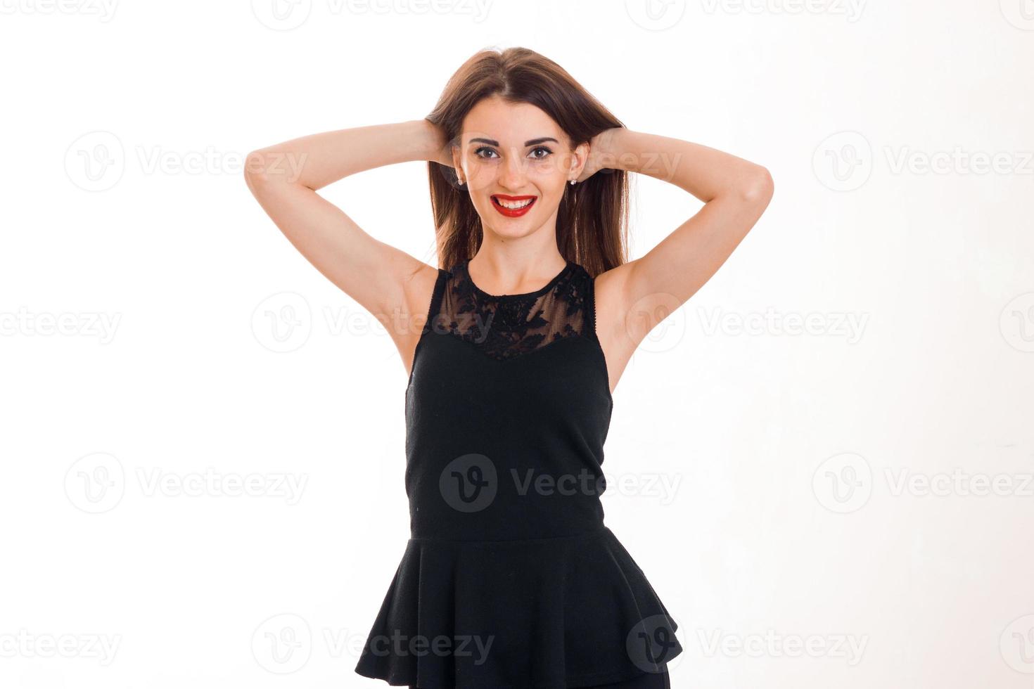 Cheerful brunette lady with red lips smiling on camera isolated on white background photo