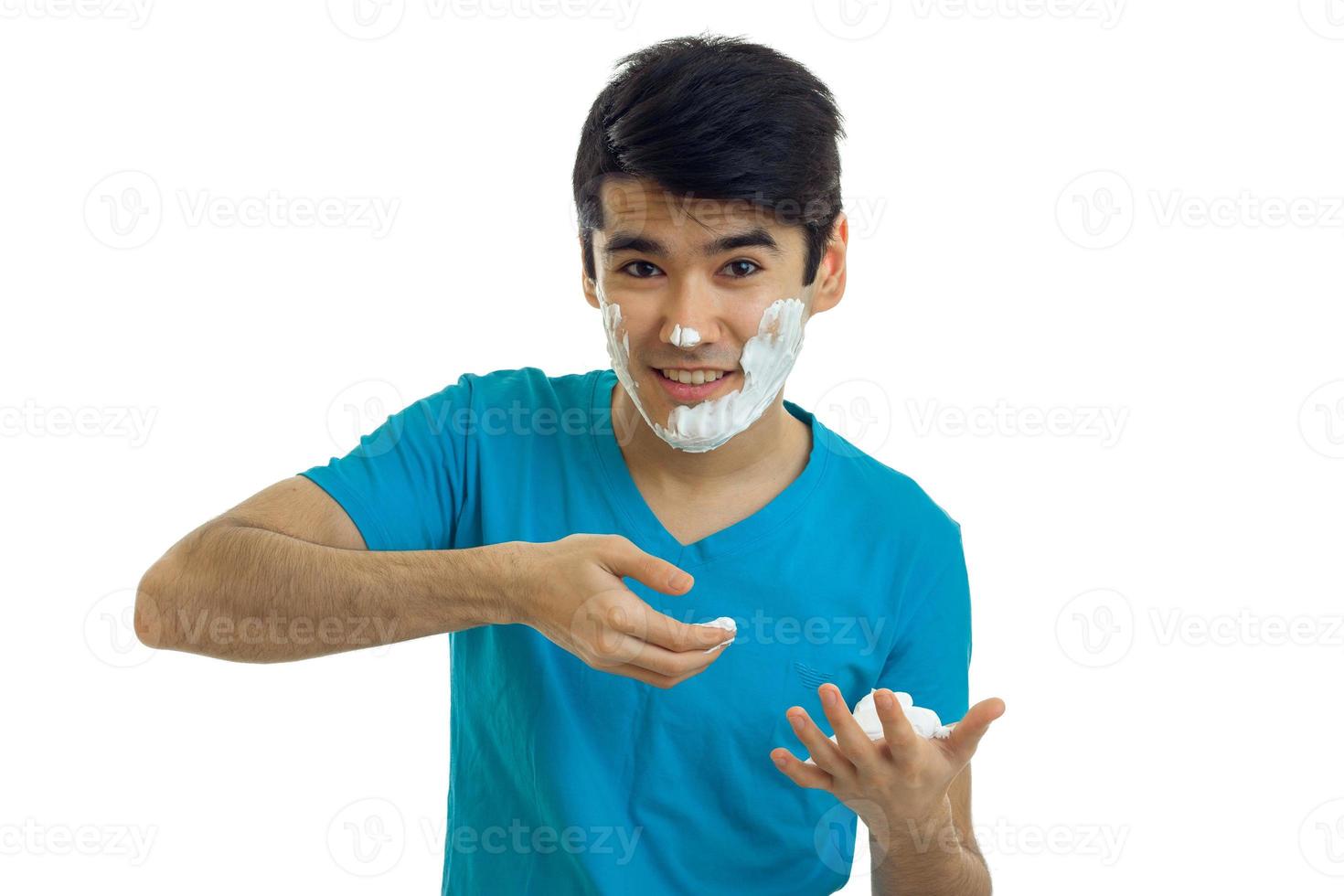 young gay guy in the blue shirt deals on face shaving foam and smiling photo