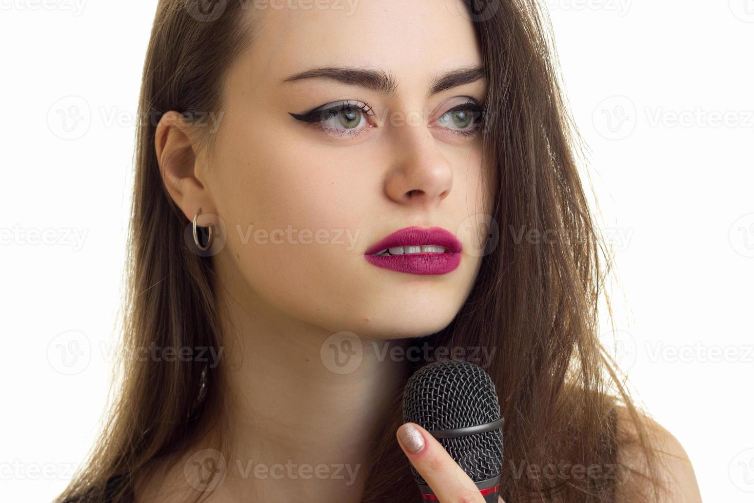 pretty woman sings a karaoke photo