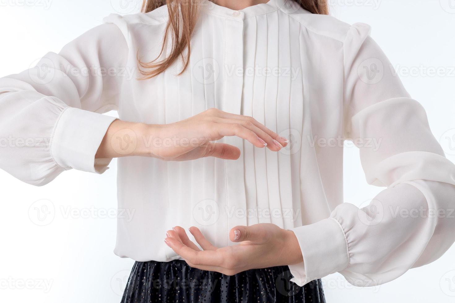 girl holds two hands behind one opposite another close-up photo