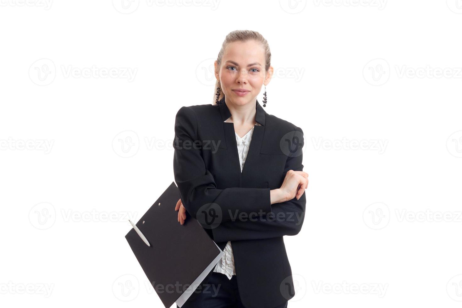 beautiful smiling girl standing in an Office suit with Tablet arms folded photo