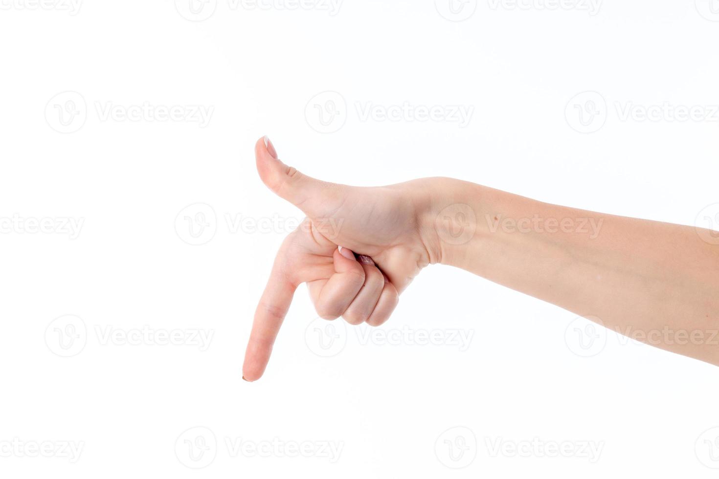mano de mujer con el dedo índice de las aletas bajadas aisladas sobre fondo blanco foto