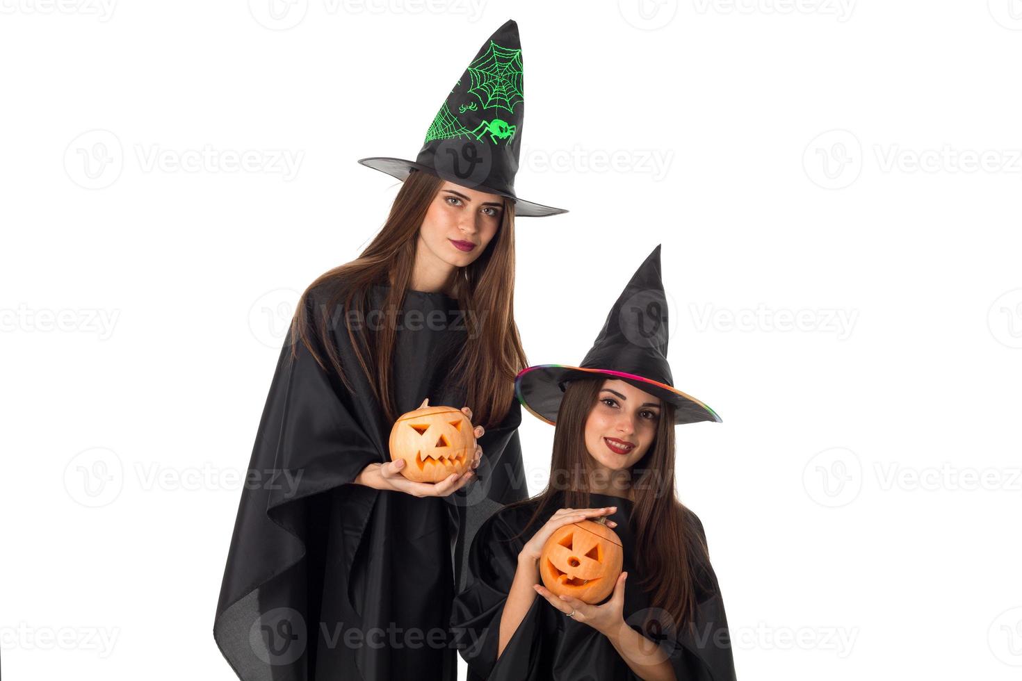 lovely young women with pumpkins in hands photo