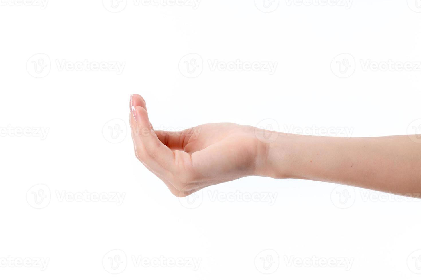 female hand outstretched to the side with bent hands isolated on white background photo