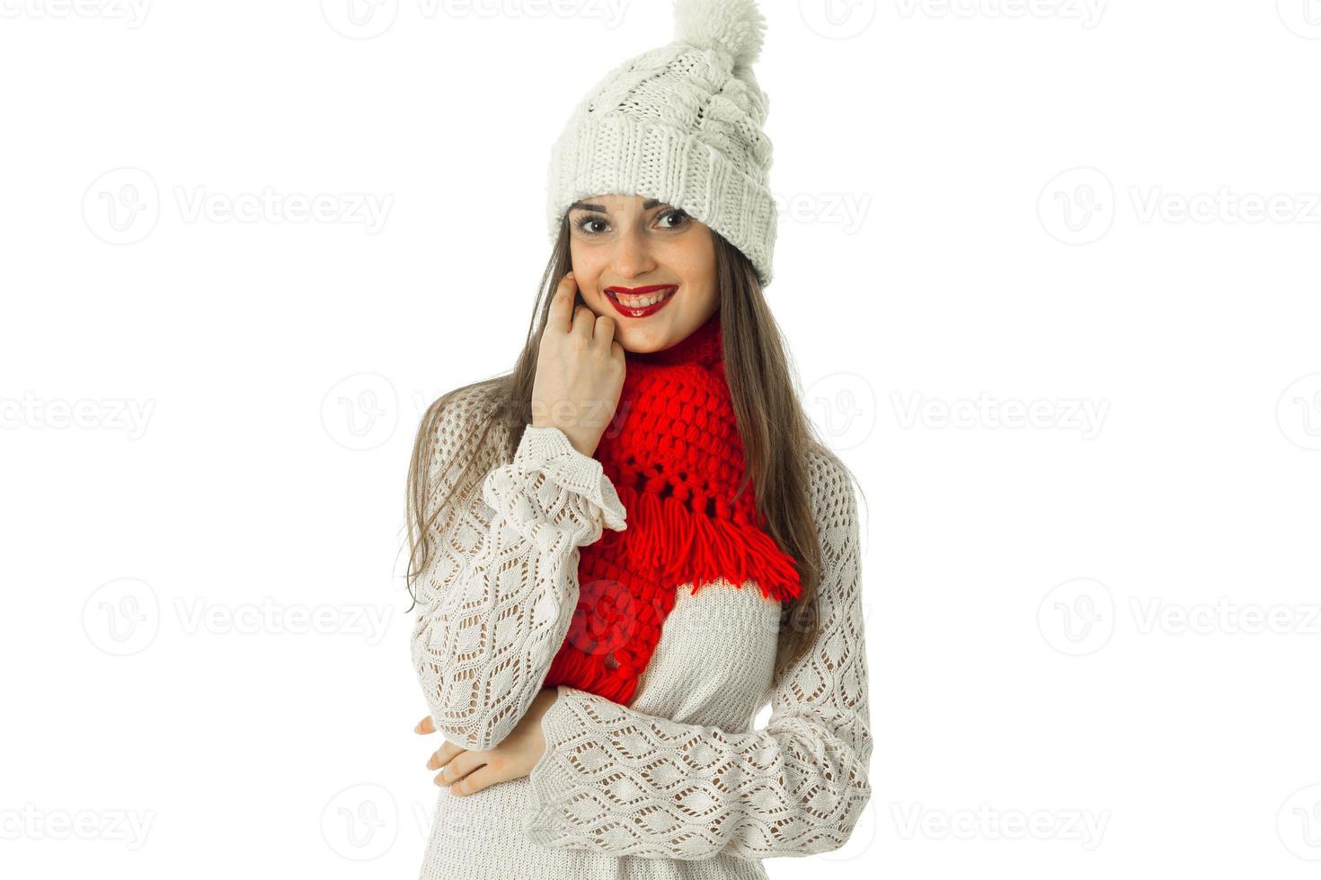 brunette girl in warm sweater and red scarf photo