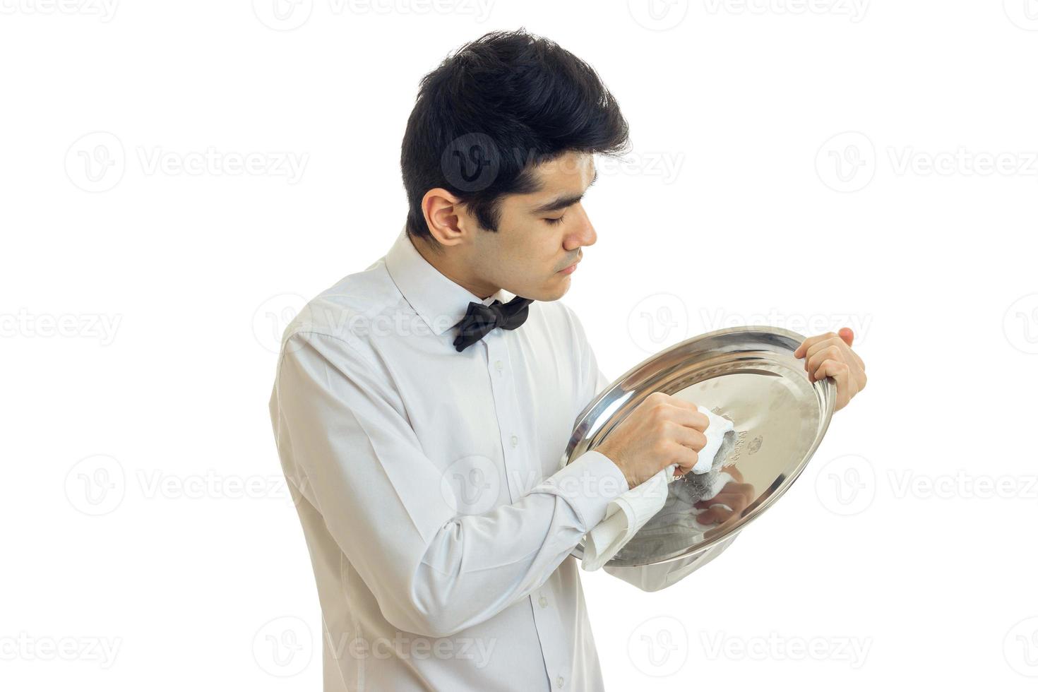 guy waiter cleans tray cloth photo