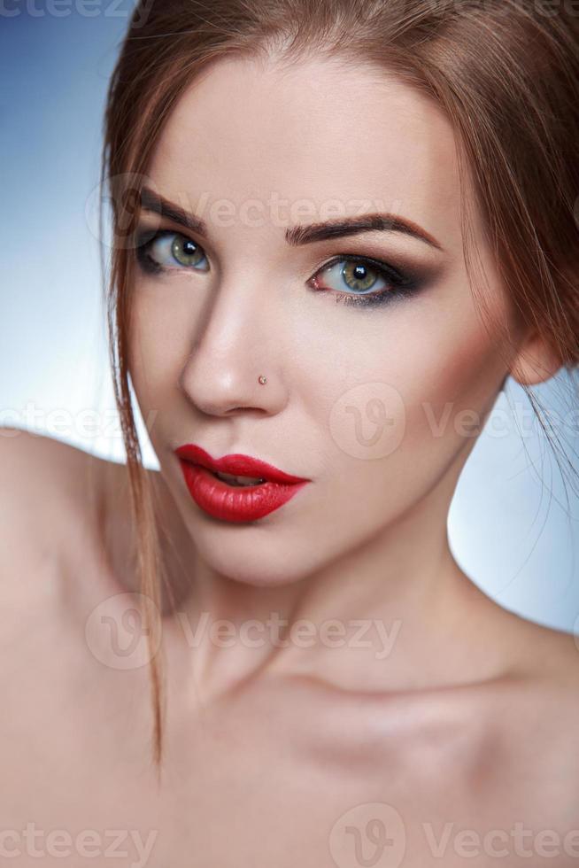 Stunning adult female looking at camera in studio photo