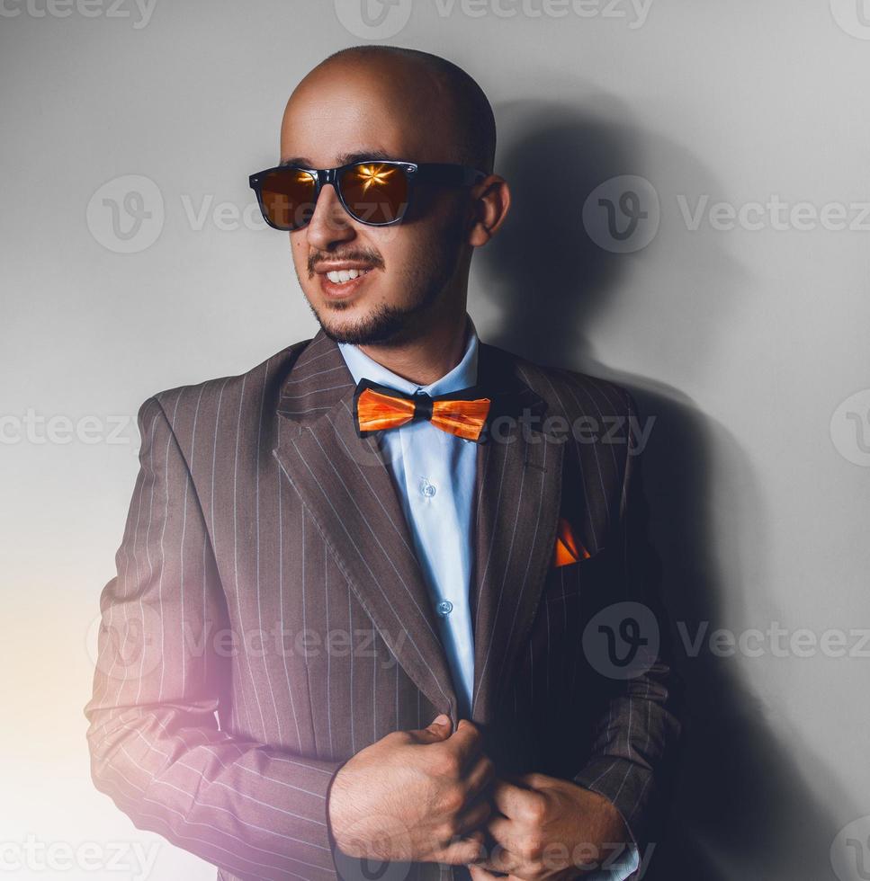 Male in suit on gray background photo