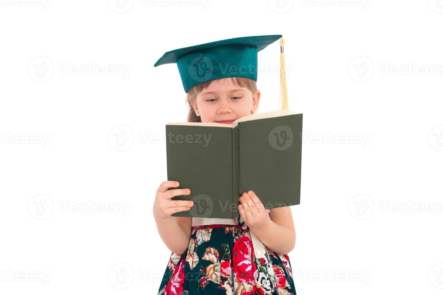 Girl in a hat with a book photo