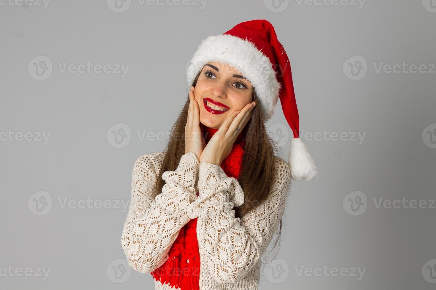 girl in santa hat and red scarf photo