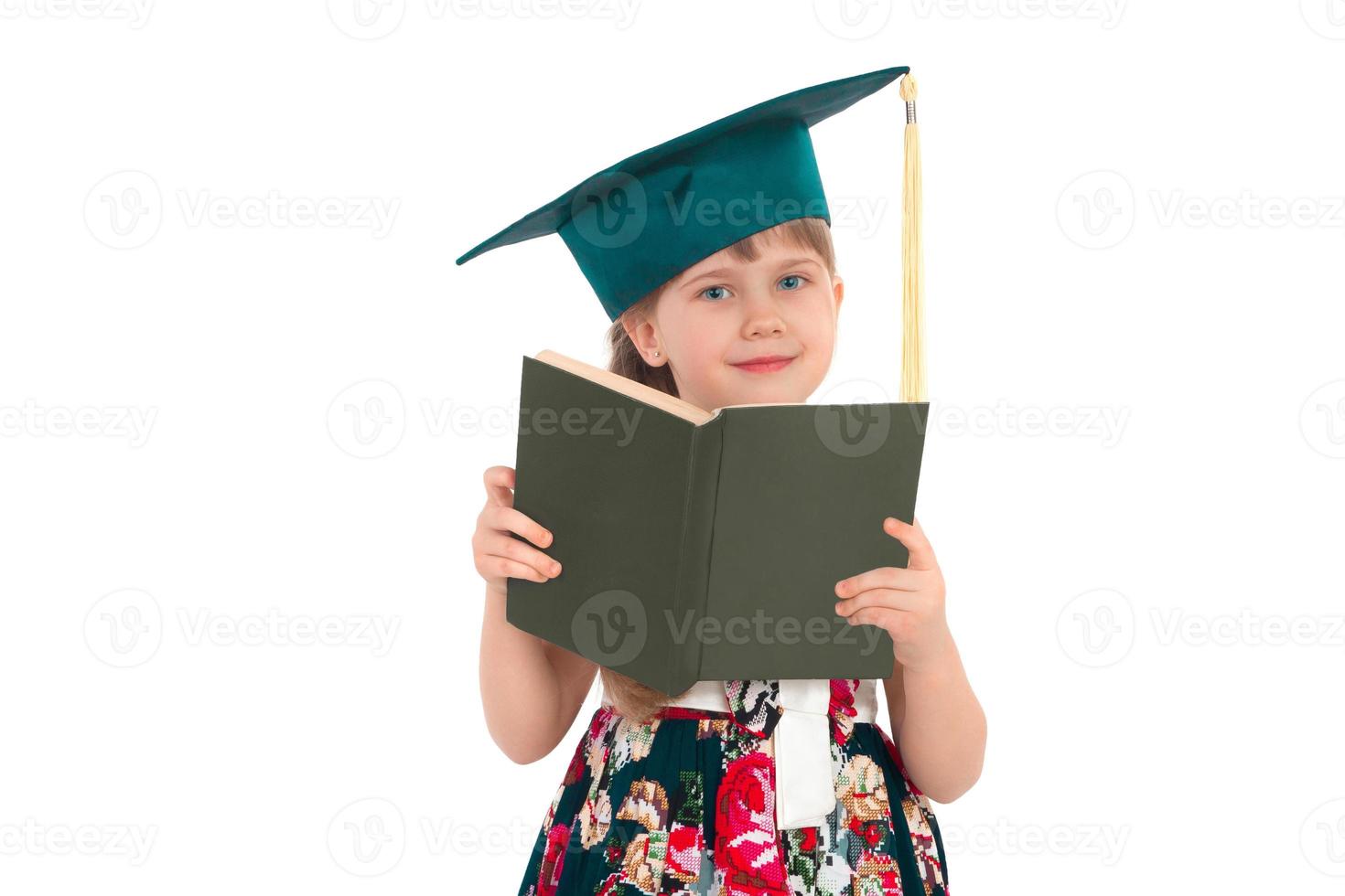 Girl in a hat with a book photo