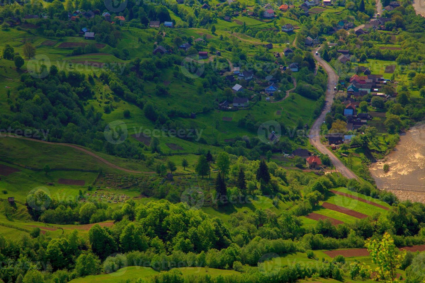 small village in the hilly landscape photo