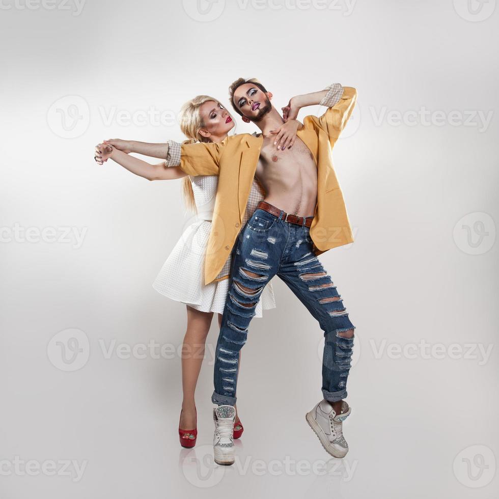 Sexual couple in love posing. Both with makeup photo