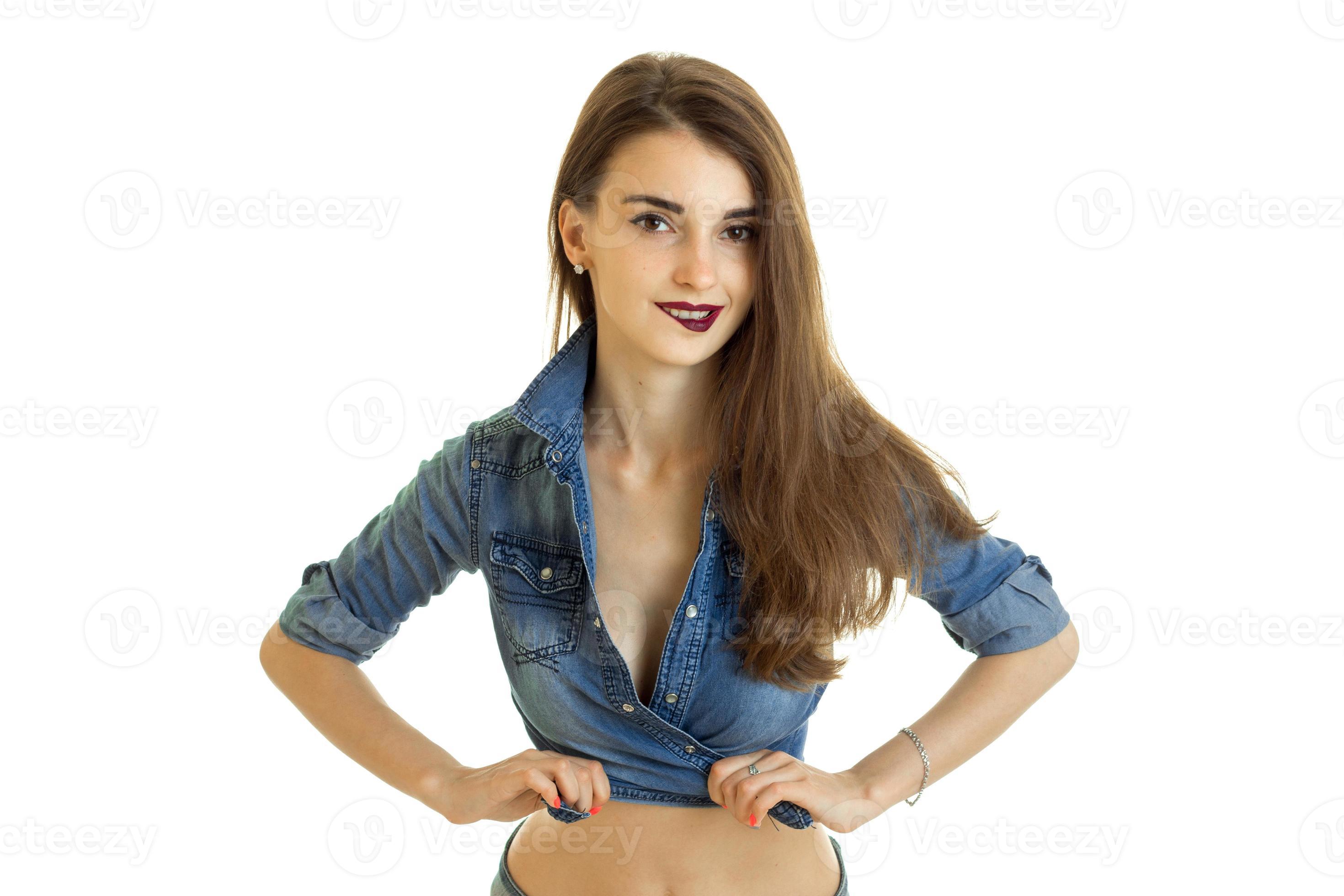 Cutie young girl in jeans t-shirt without bra bite a lips 16097278 Stock  Photo at Vecteezy