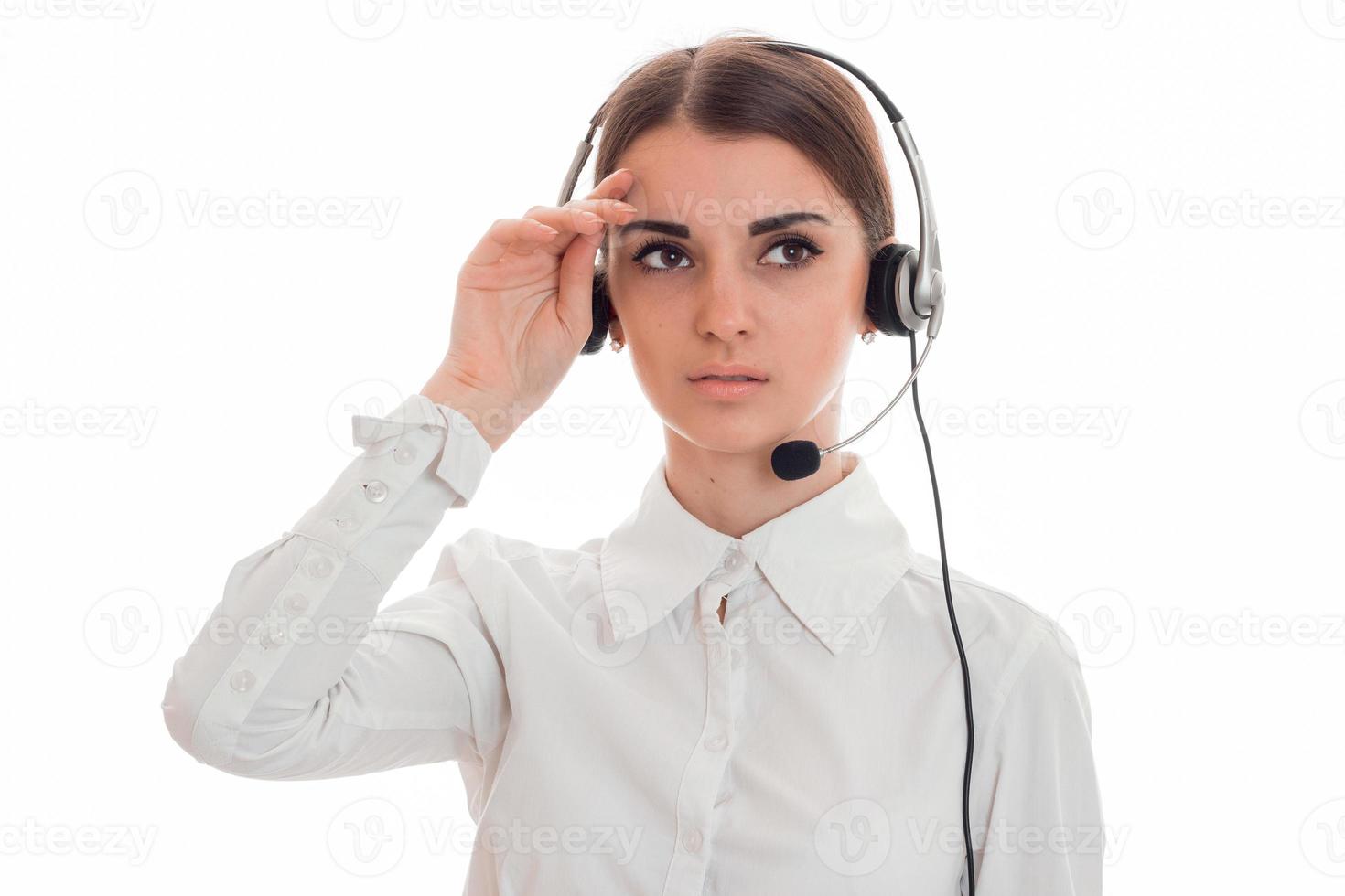 close up of young tired call center woman woman with headphones and microphone isolated on white background photo