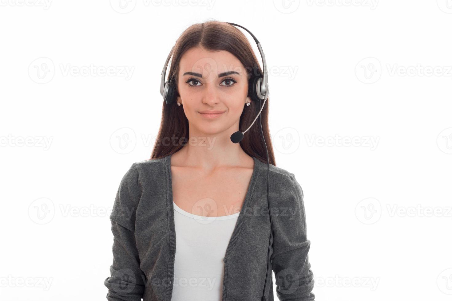 young beautiful business lady with headphone and microphone looking at the camera and smiling isolated on white background photo