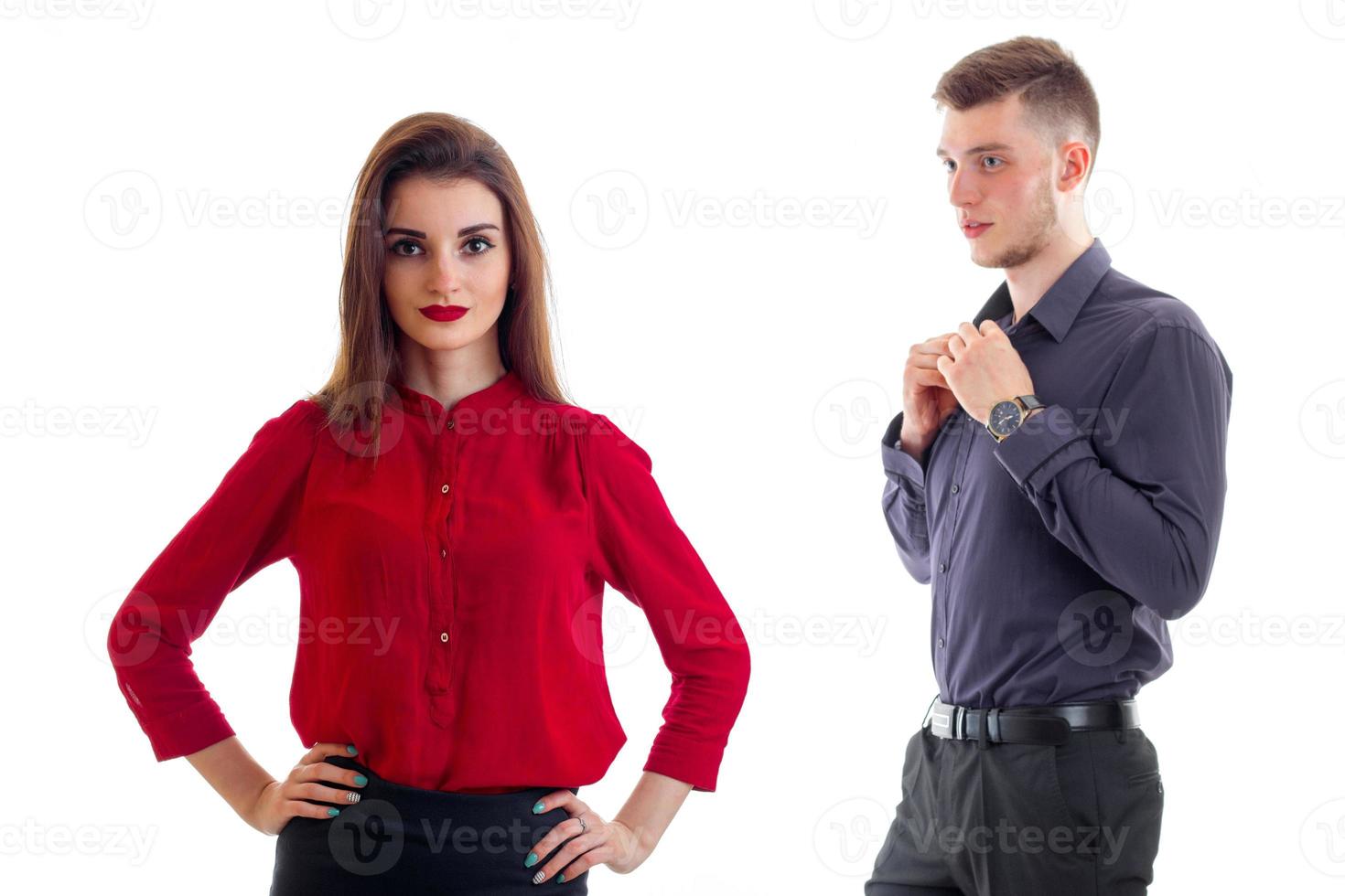cute girl in the red shirt and the guy looks at her loving gaze photo