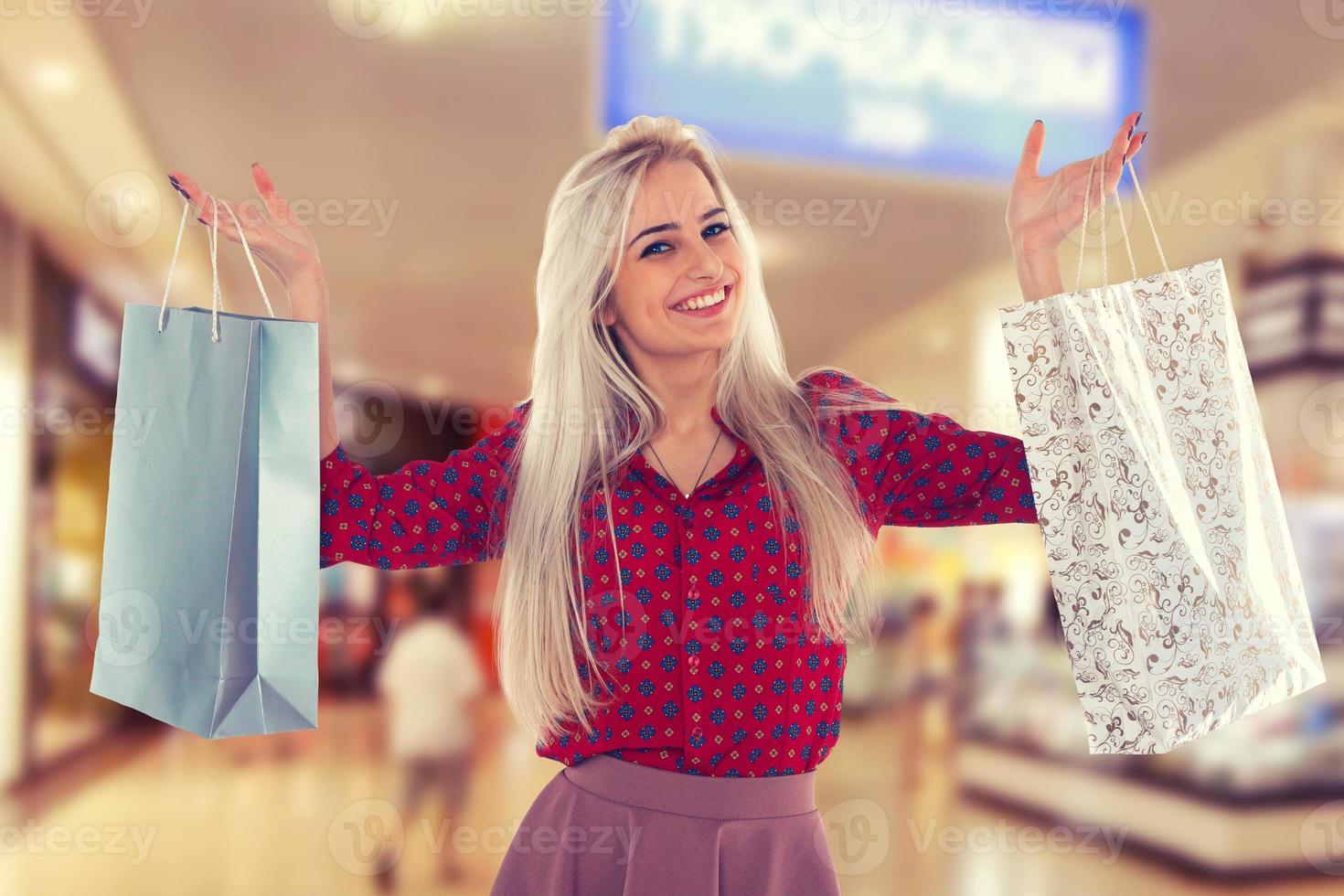 Slender girl with shopping bags photo