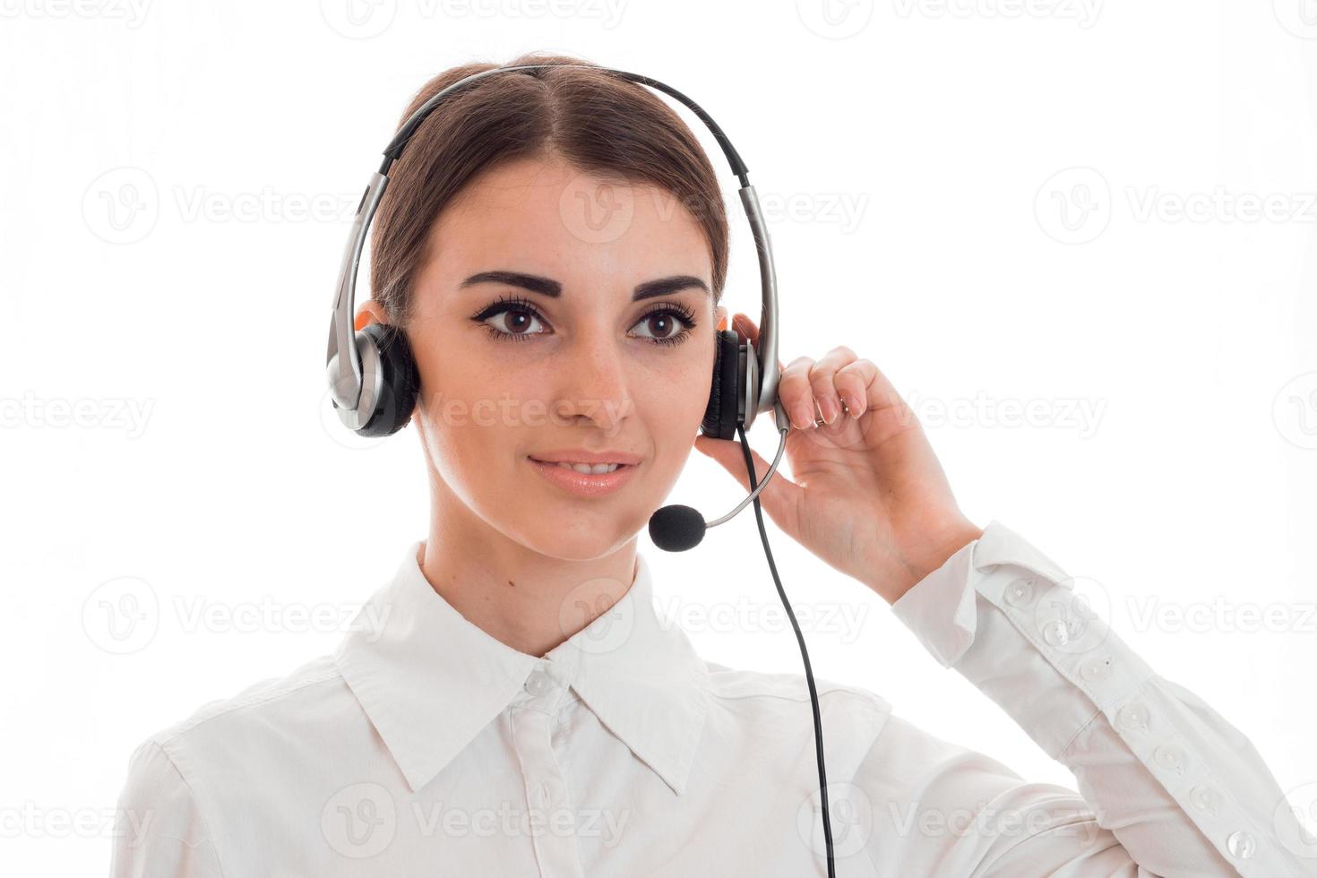 Portrait of a young beautiful girl in headphones with microphone closeup photo