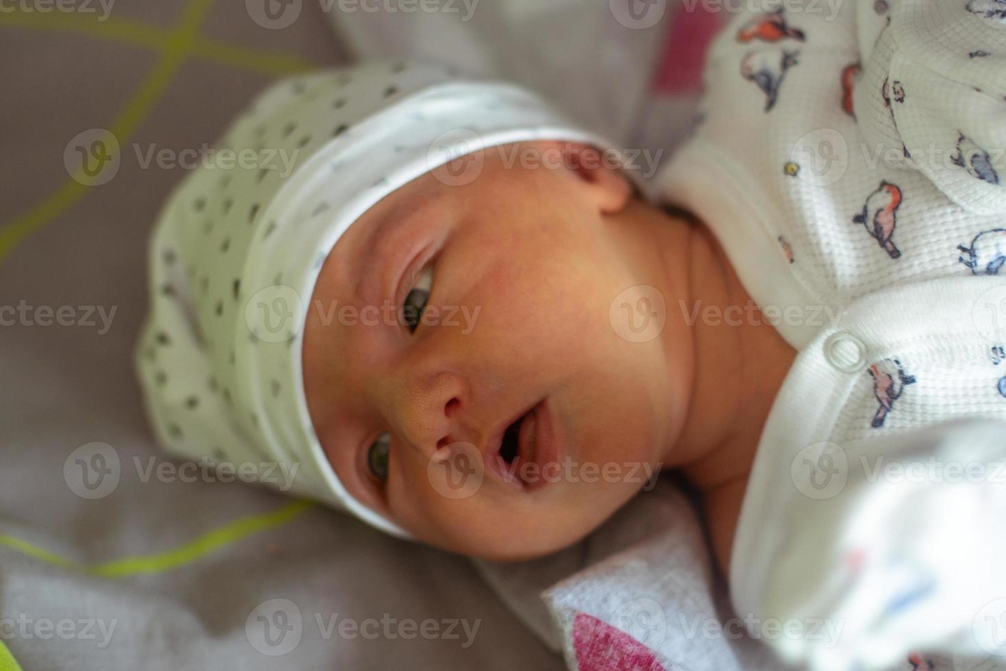 Portrait of a cute newborn girl photo