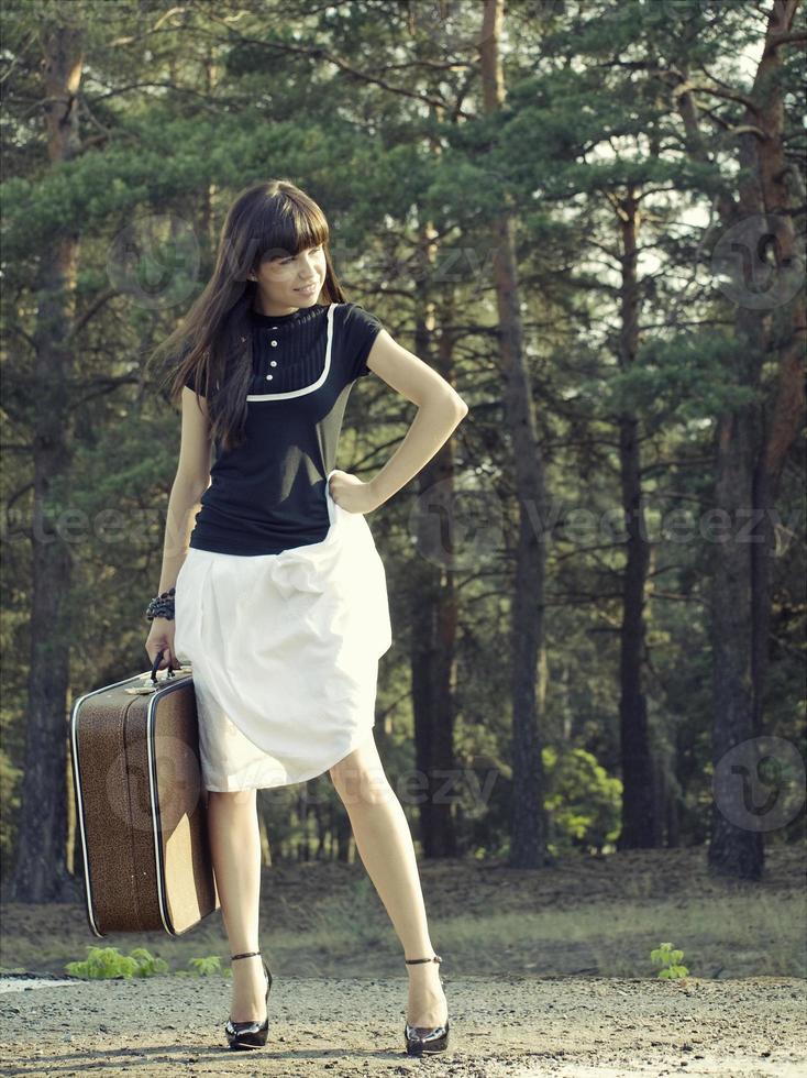 Woman with suitcase photo