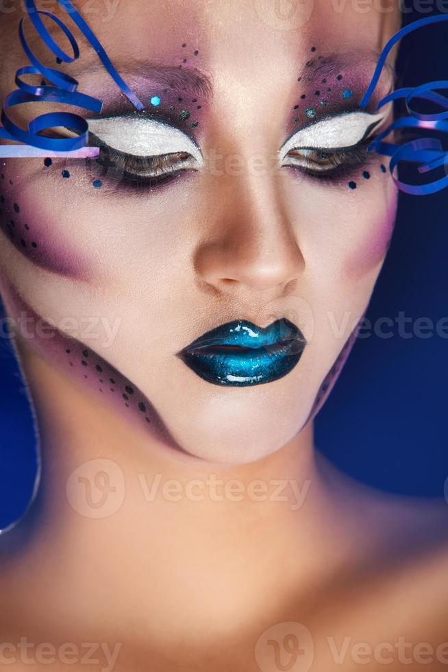 sexy female with creative make up in studio photo