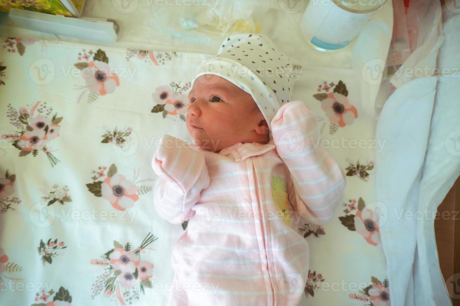 Portrait of a cute newborn girl photo