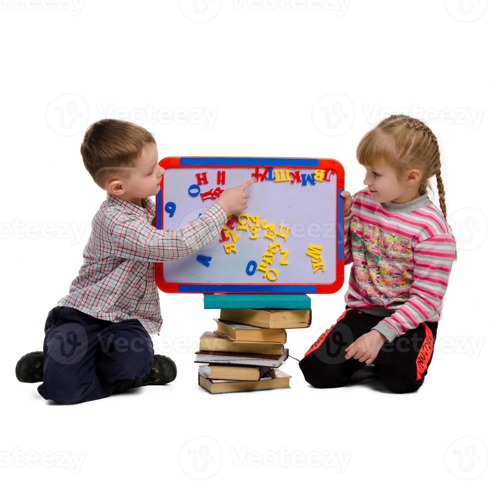 boy and girl learn alphabet photo