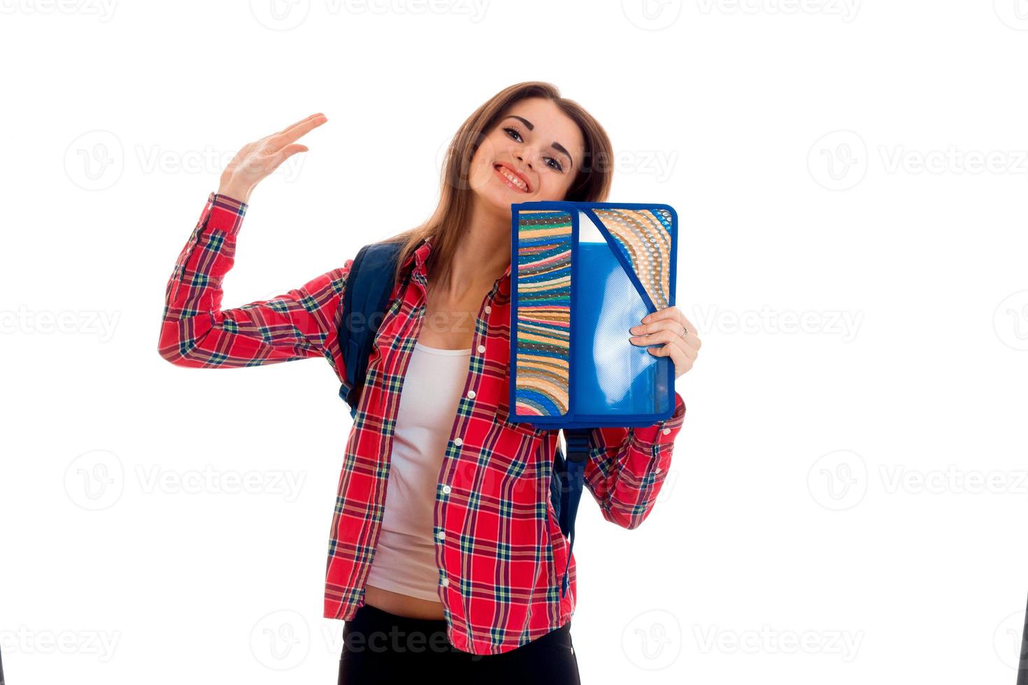 young happy student girl with folders for notebooks posing isolated on white background in studio photo