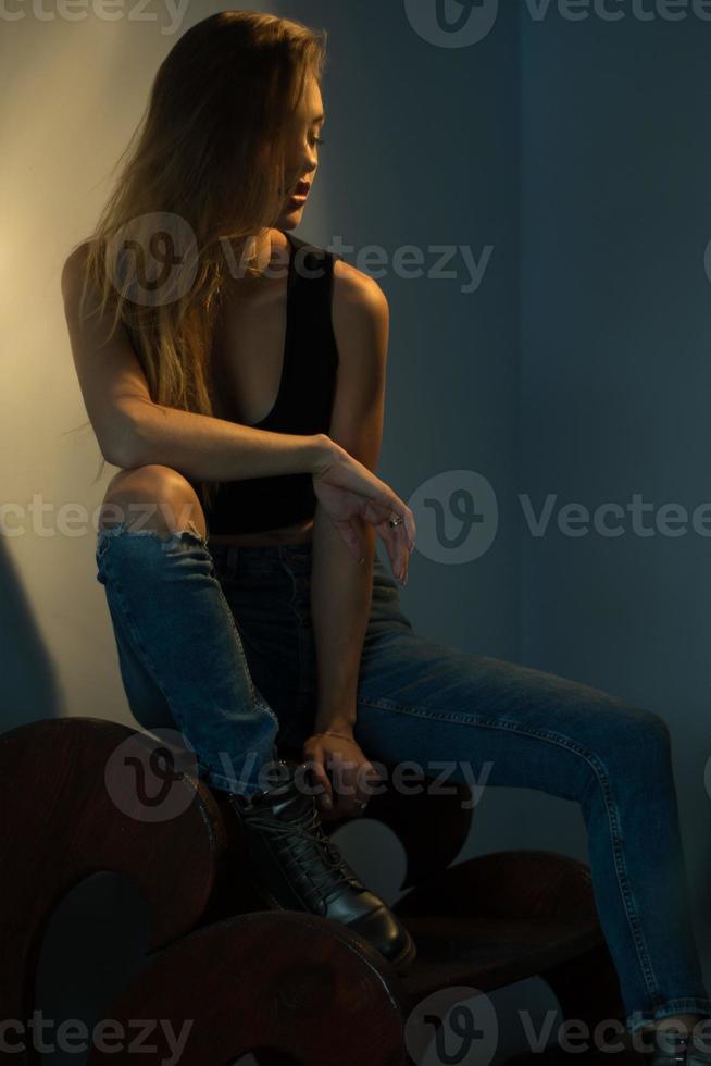 Charming young blonde woman posing with closed eyes photo