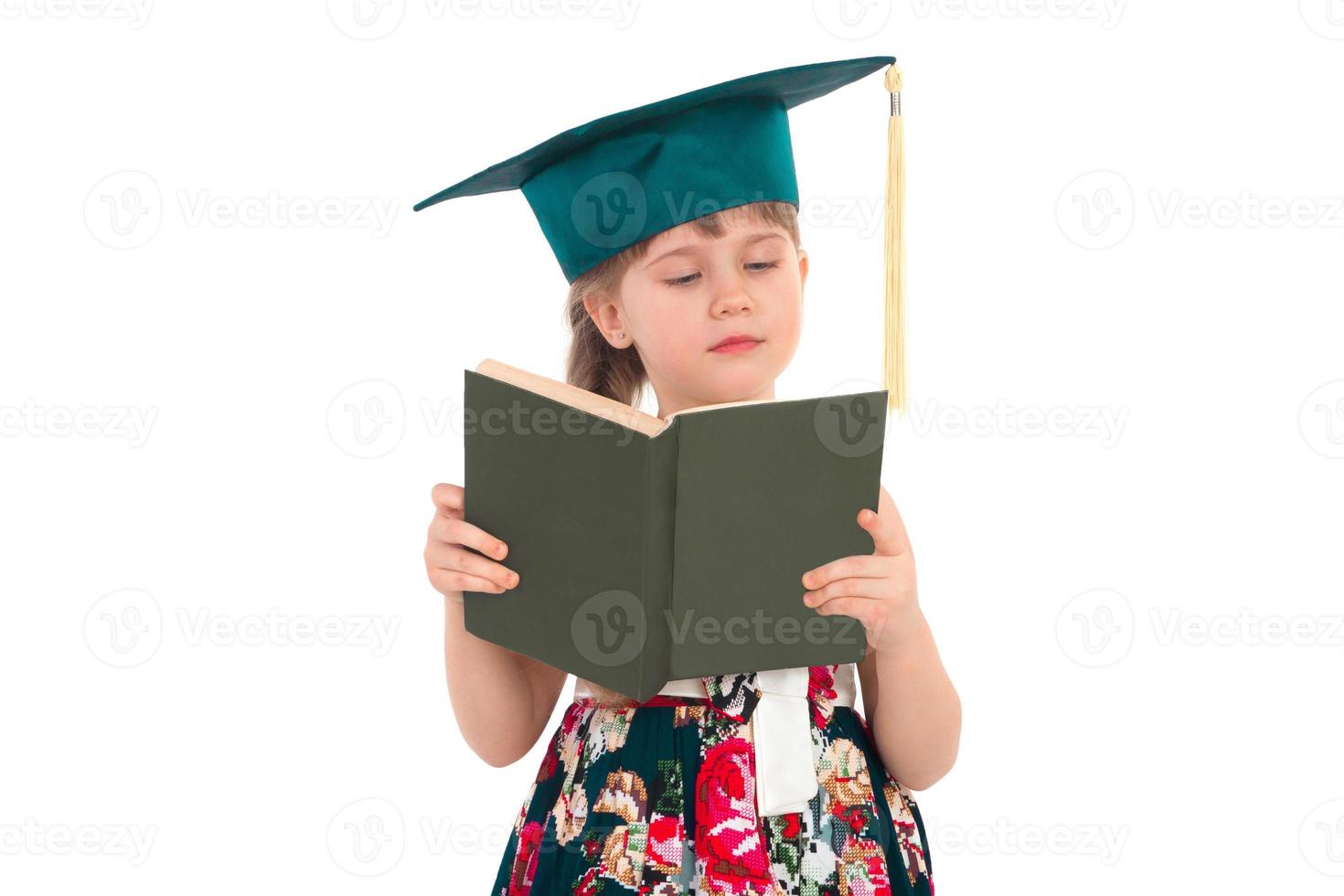 Girl in a hat with a book photo