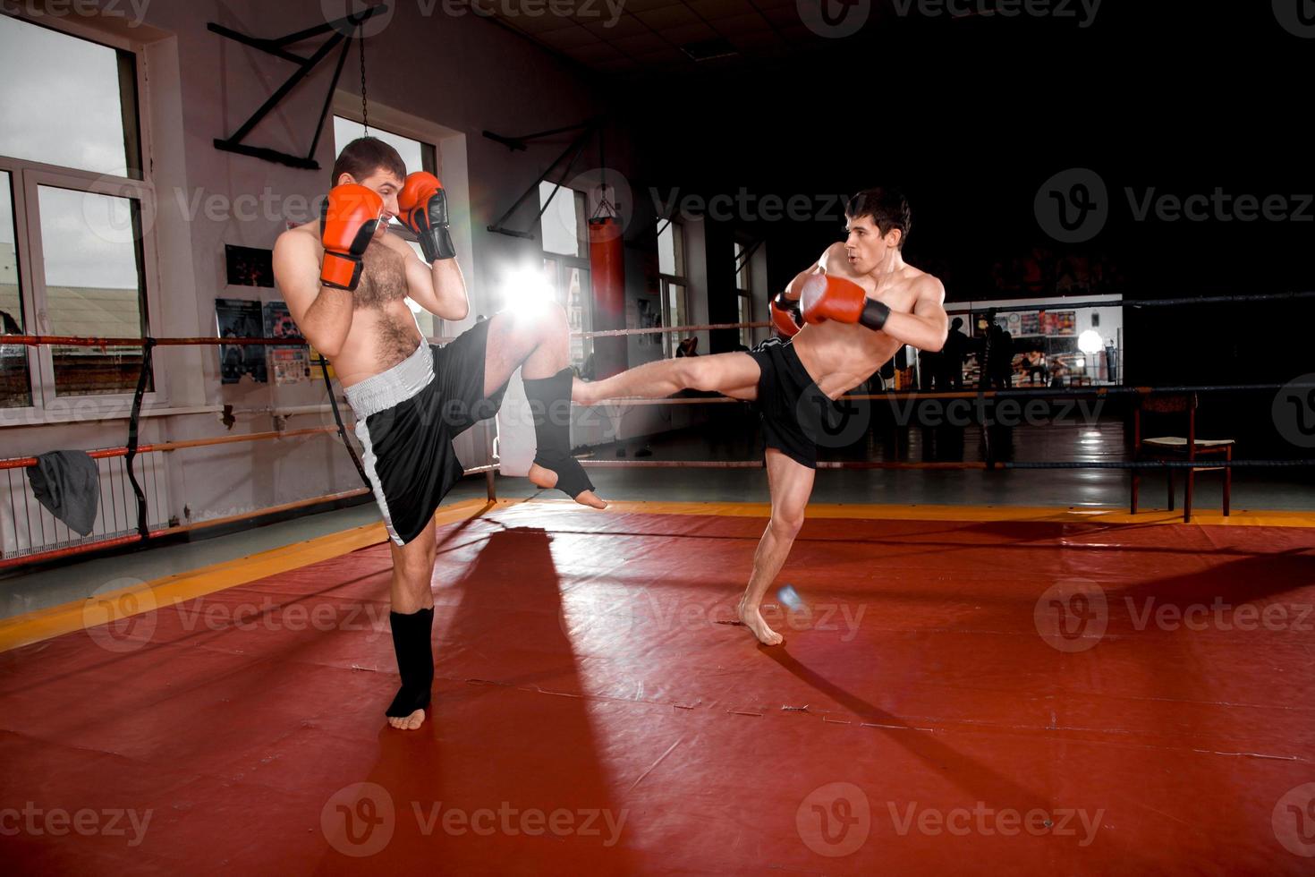 Two men is boxing on the ring photo