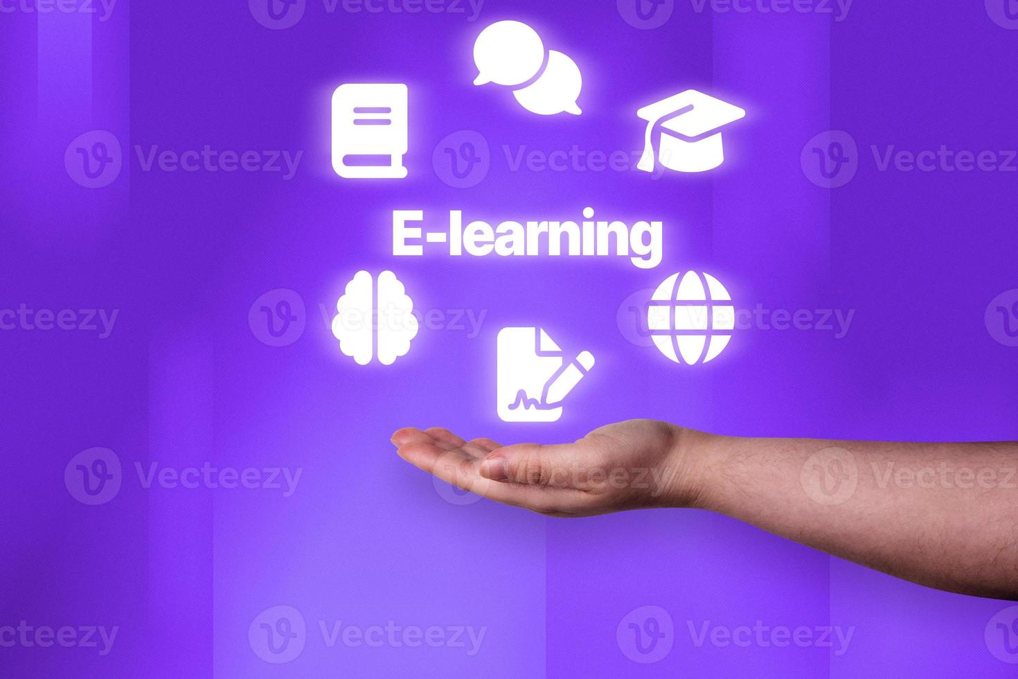 Woman hand showing E-Learning icons over light purple background. Distance education. Online study. Webinar, courses, seminar and conference. photo