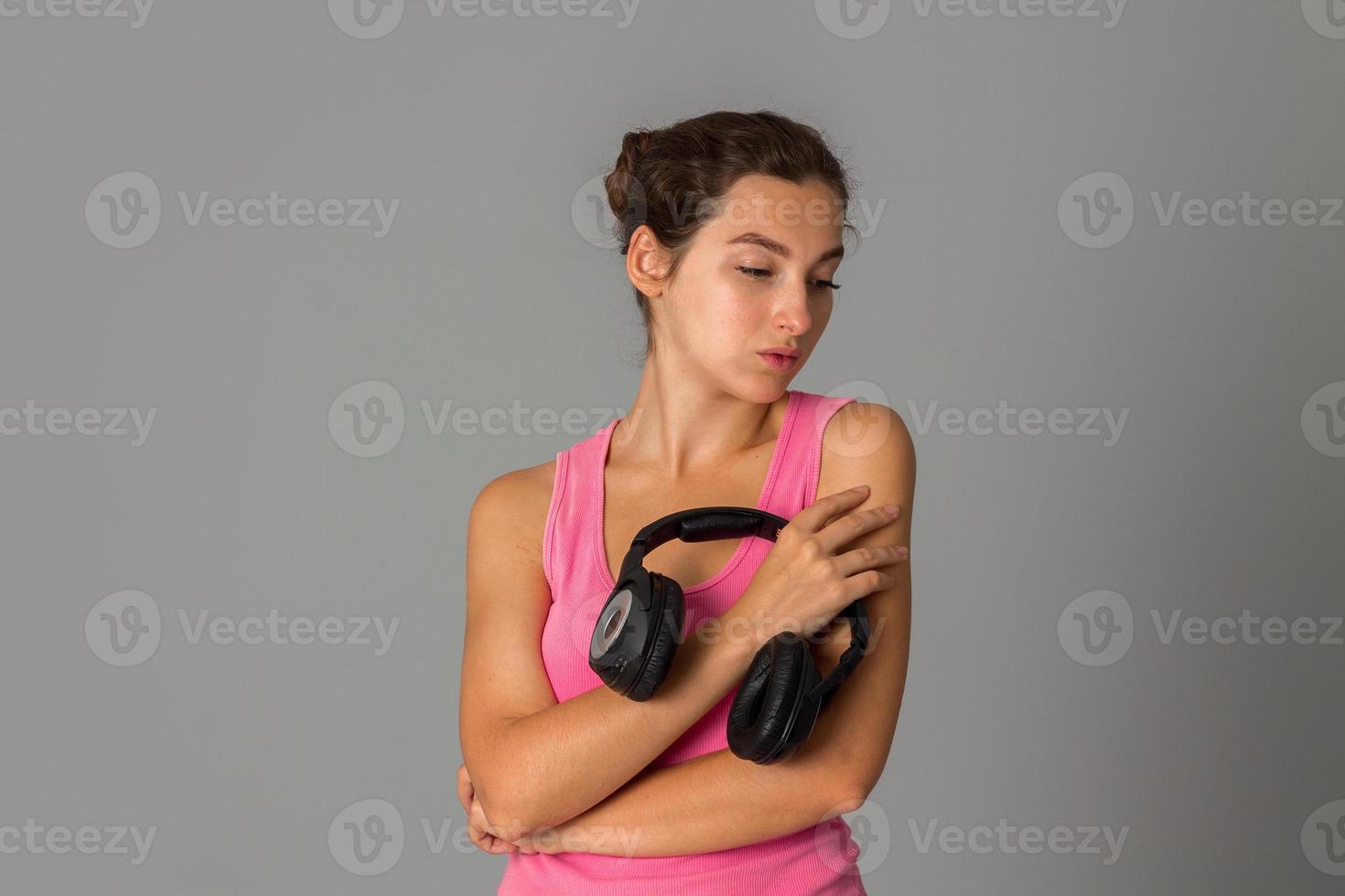 girl with headphones in studio photo
