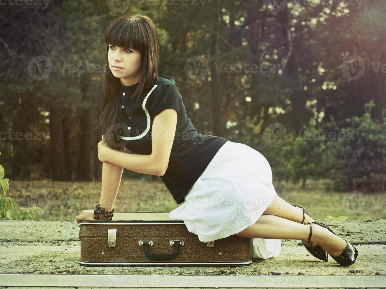 Woman with suitcase photo