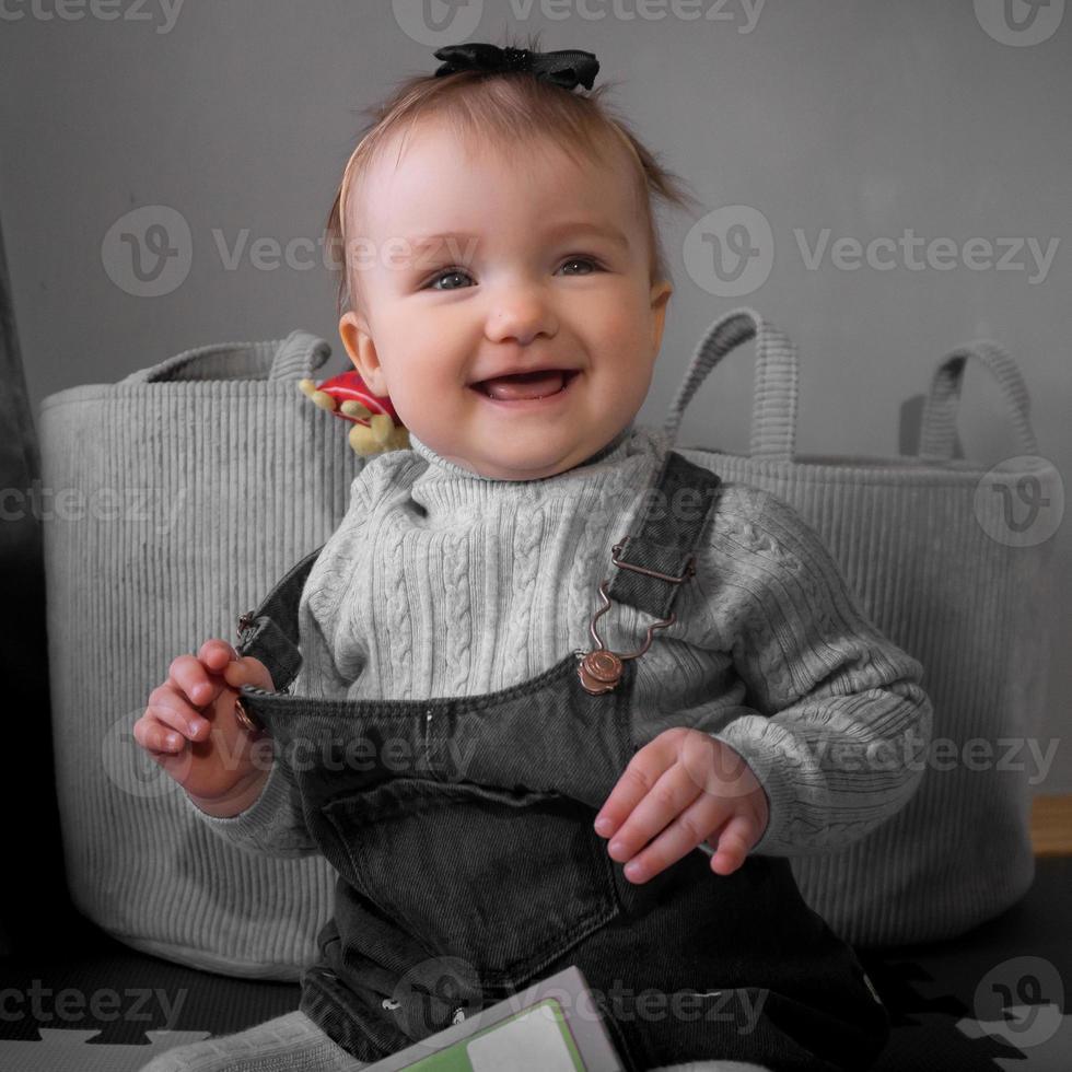 Cutie little baby girl smiles at home photo