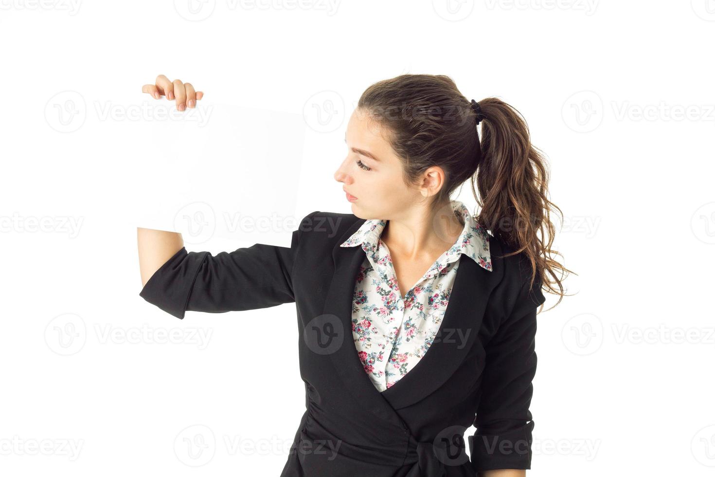 woman in uniform with white placard in hands photo