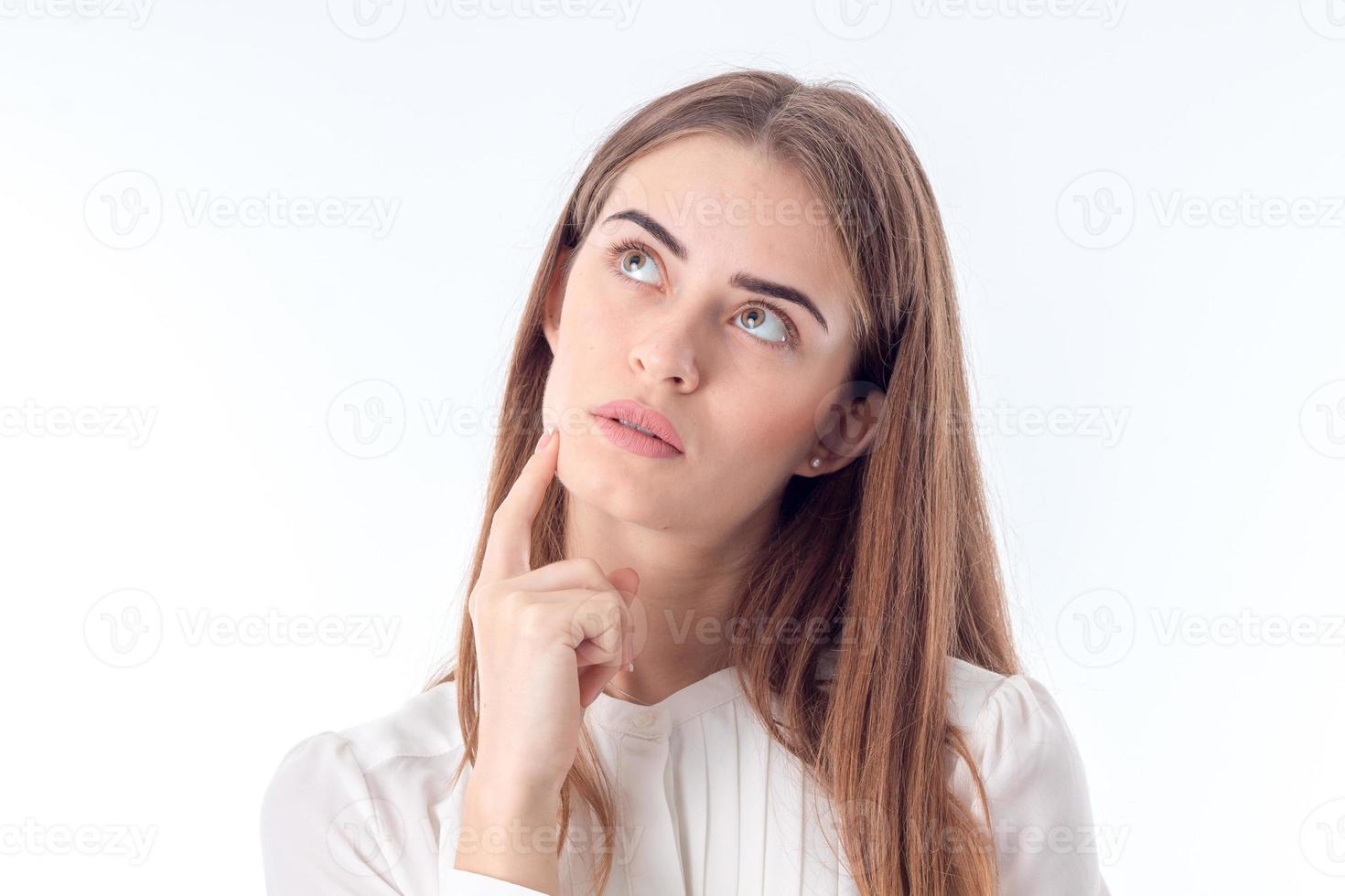 Portrait of a young girl who he looked up  isolated on white background photo