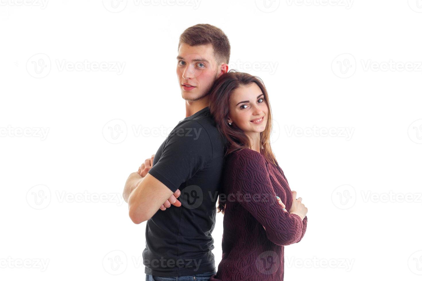 smiling pin-up girl is standing next to a high cute guy back to back photo