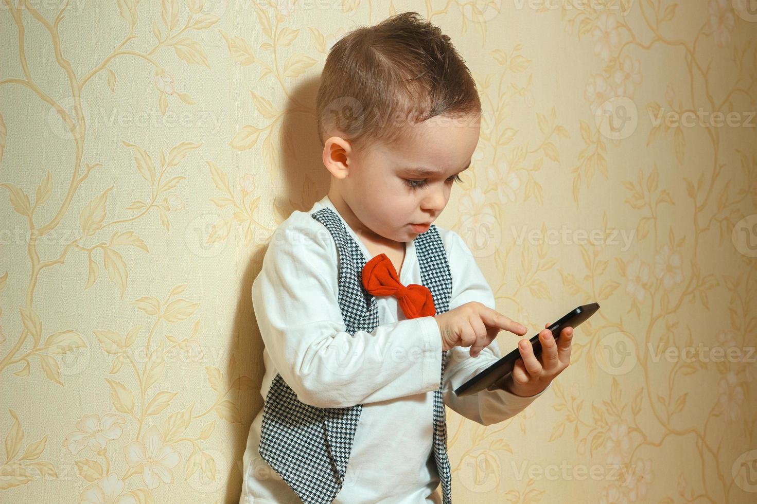 elegant boy with mobile phone photo