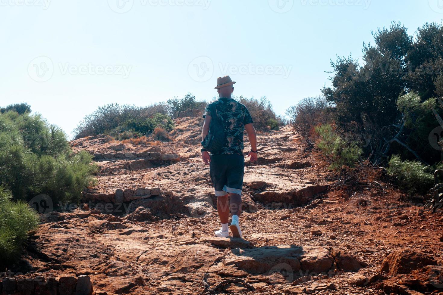 stylish Guy goes uphill during the day photo