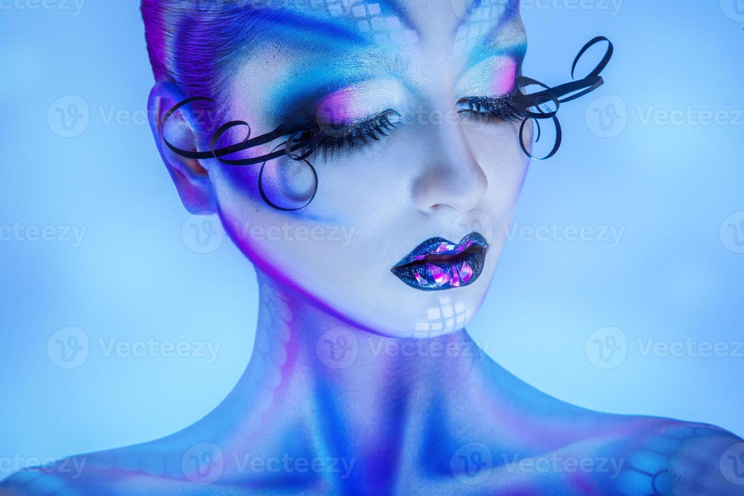 Close up portrait of sensual woman with healthy skin and creative body art photo