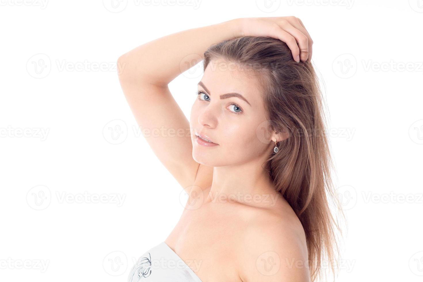 girl stands sideways and kept the ball for hair photo