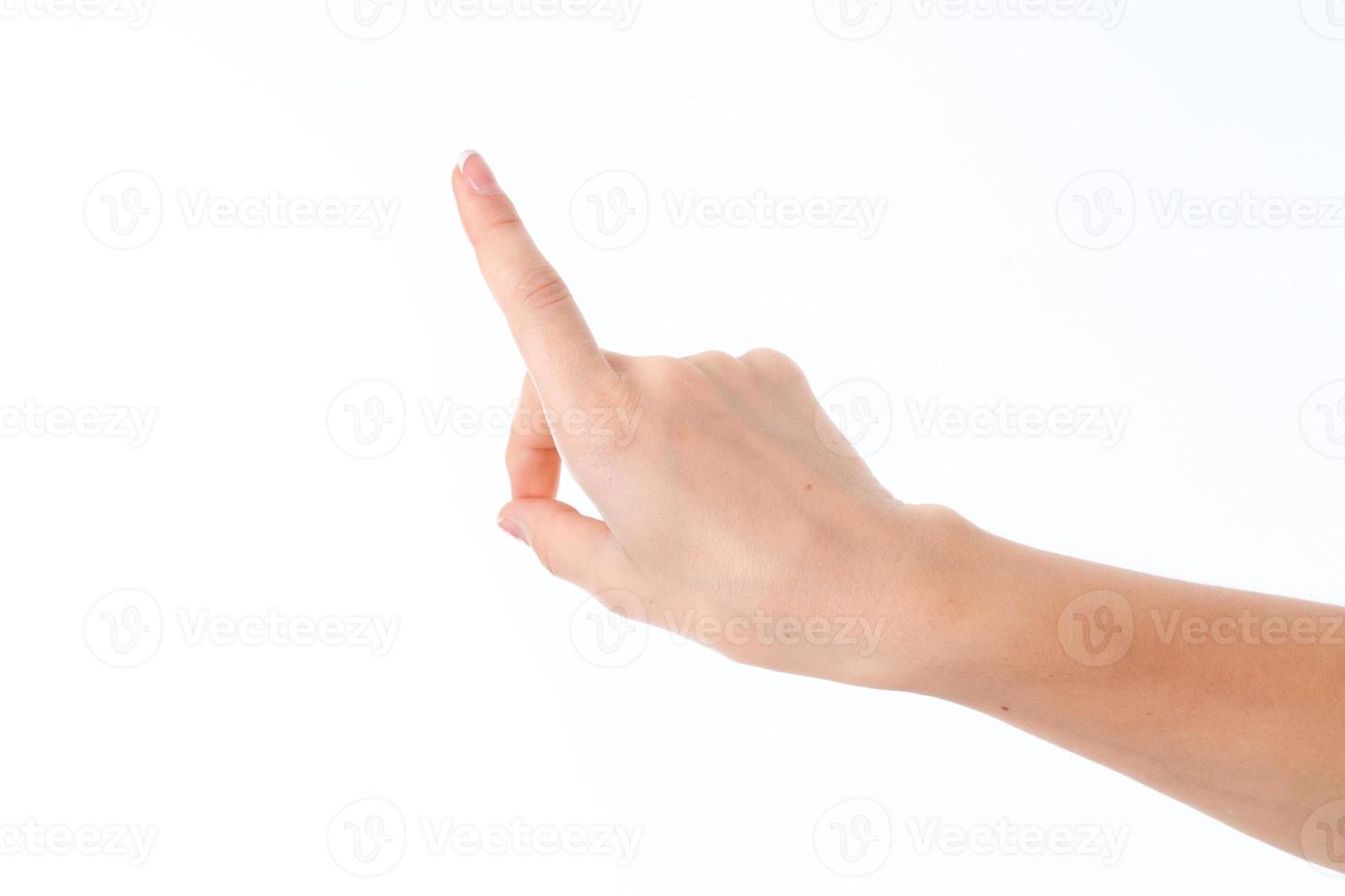 female hand outstretched forward with raised forefinger is isolated on a white background photo