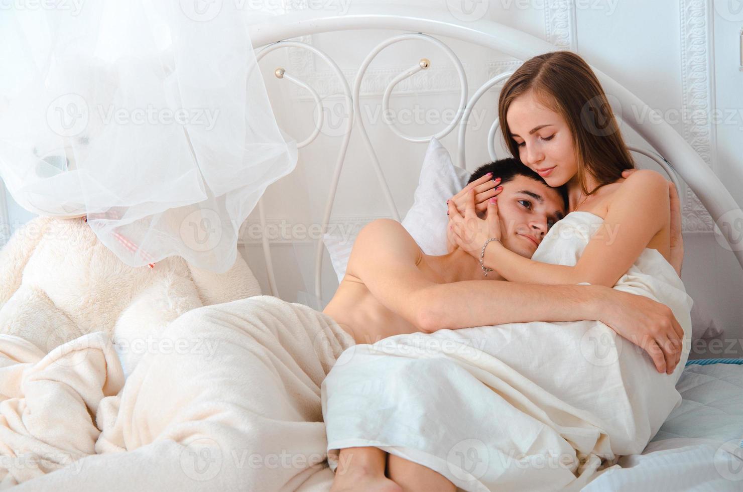 young couple in love hugging photo