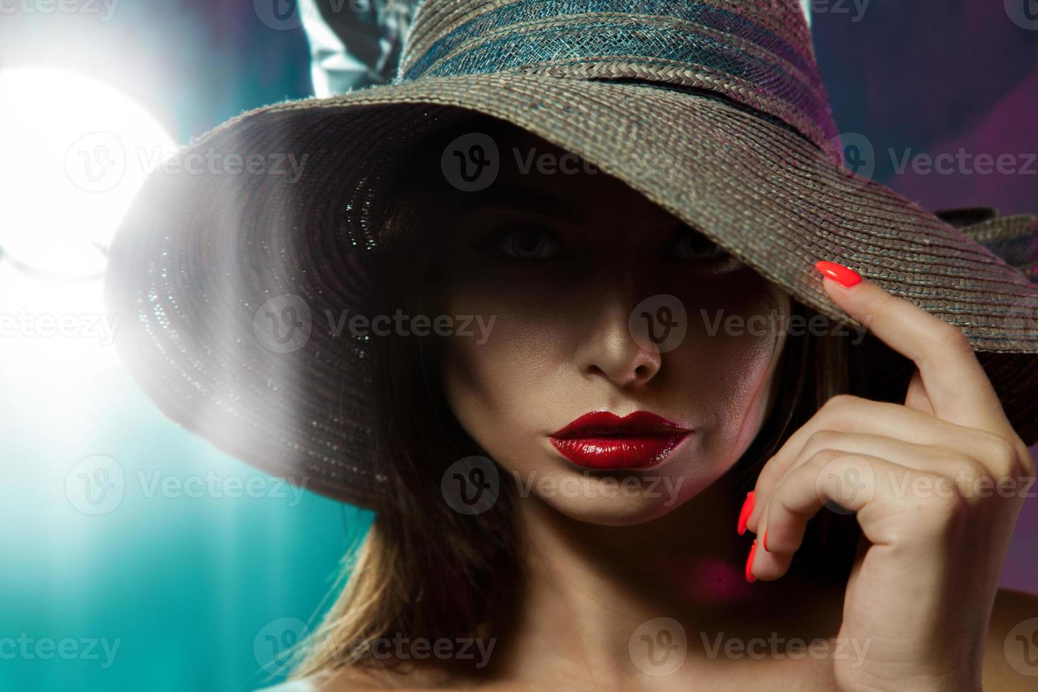 Gorgeous lay posing in studio in hat photo