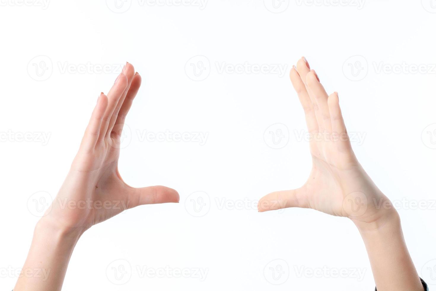 two female hands raised up one opposite the other isolated on white background photo