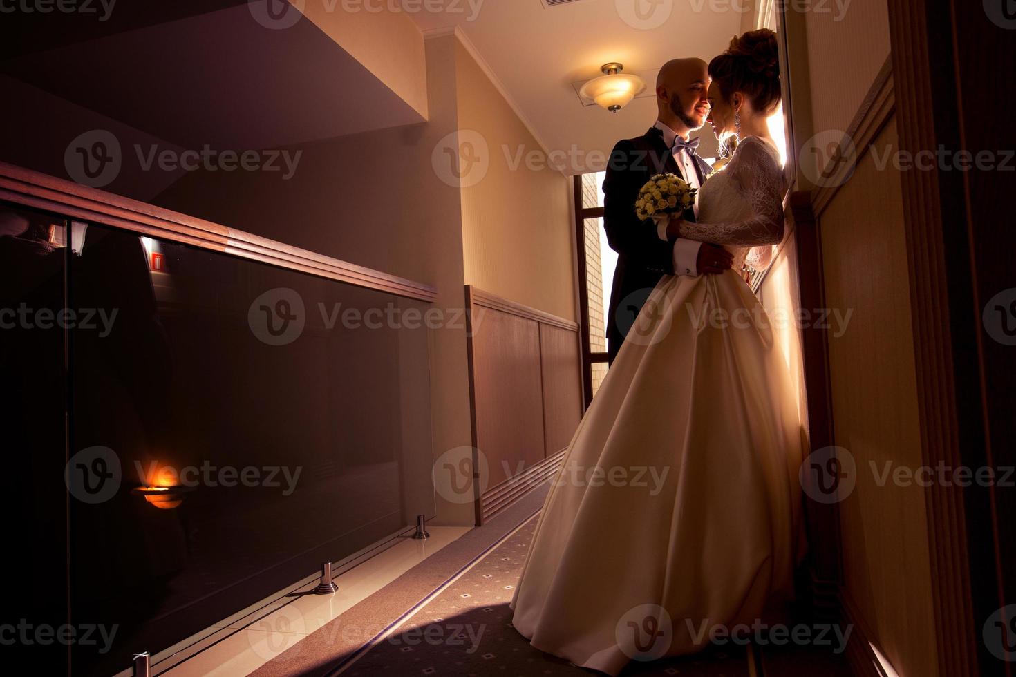 young beautiful just merried couple in love hugging photo